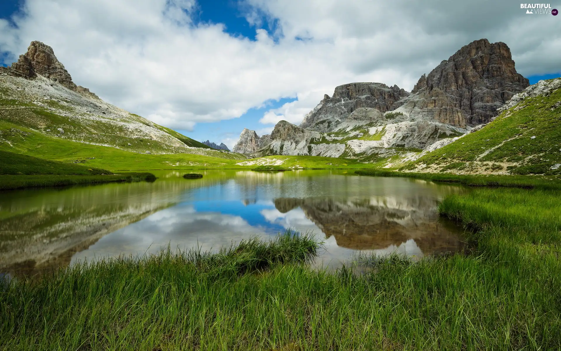 Mountains, grass, clouds, lake